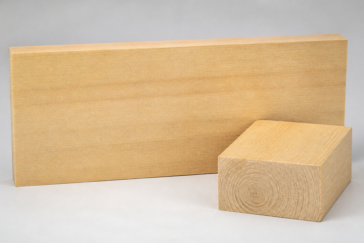Cook Pine board and end-grain sample showing pale cream timber and fine straight grain