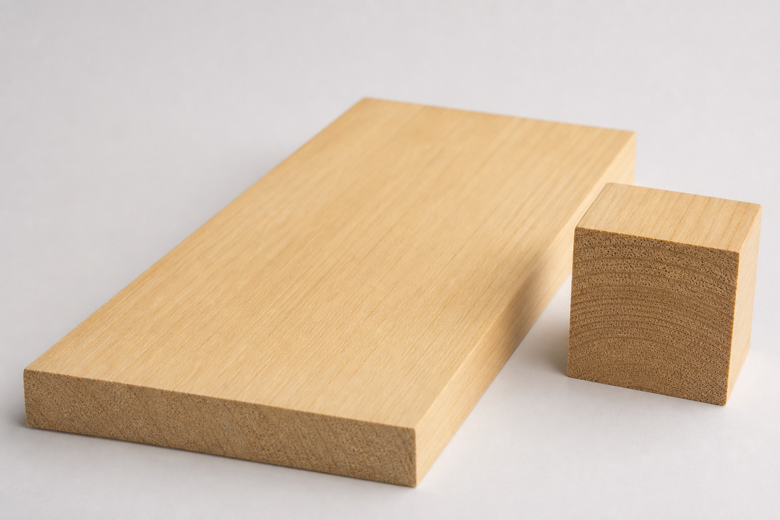 Hoop Pine board and end-grain sample showing pale cream timber and fine straight grain